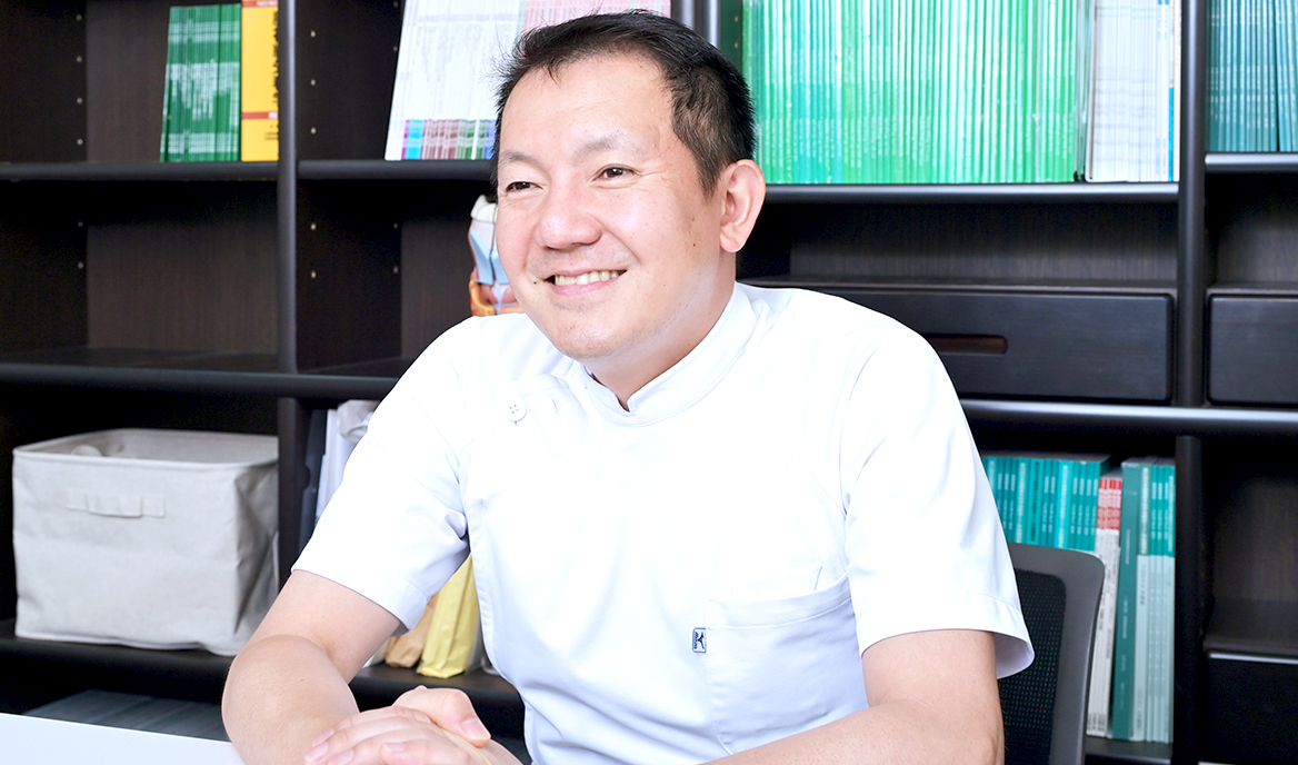 二村 吉継 院長