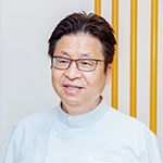 根来 良材 院長